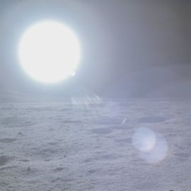 Big sun on a dark sky, taken from the Apollo 14 mission.
Source: https://www.history.nasa.gov/alsj/a14/images14.html#9234